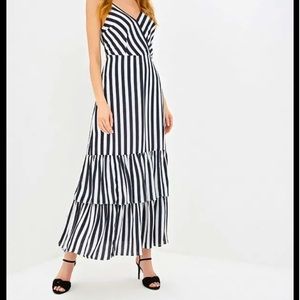 Beautiful black and white striped maxi dress with ruffle bottom